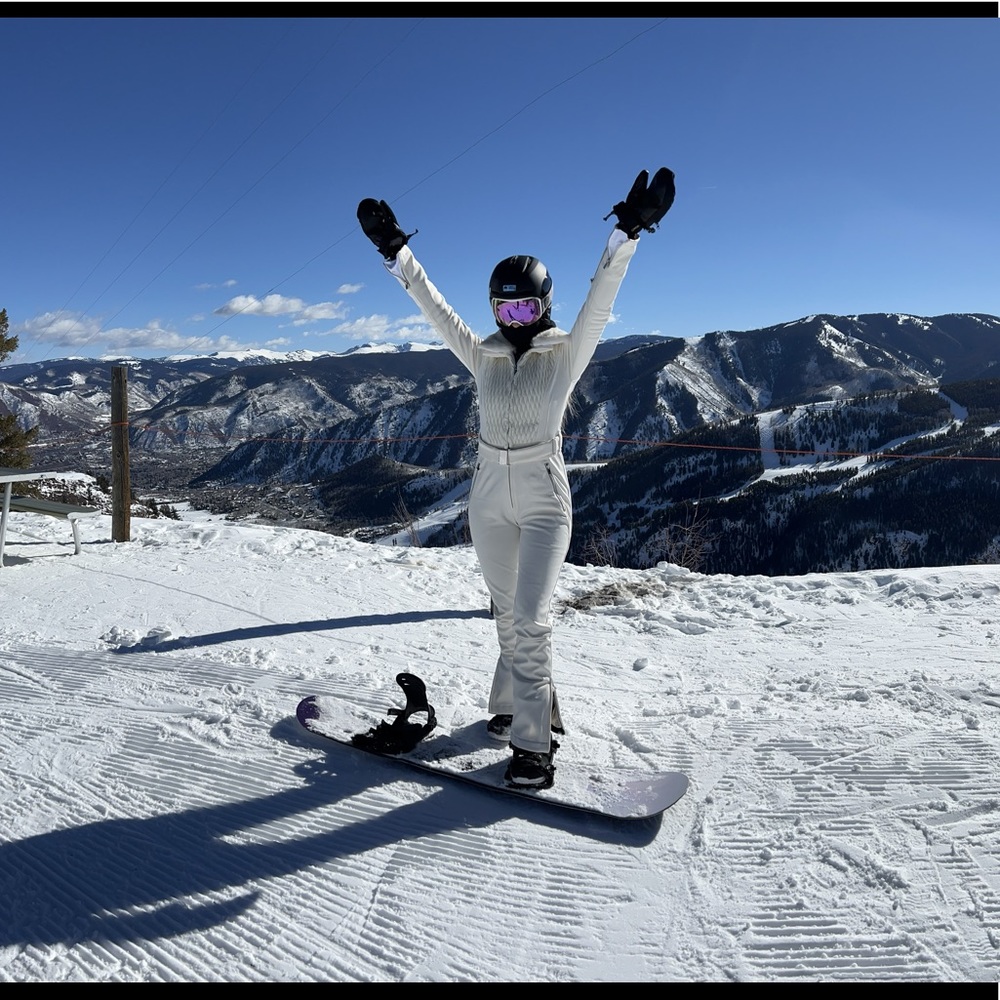 White ski suit with fur color and silver hardware. WORN ONCE.